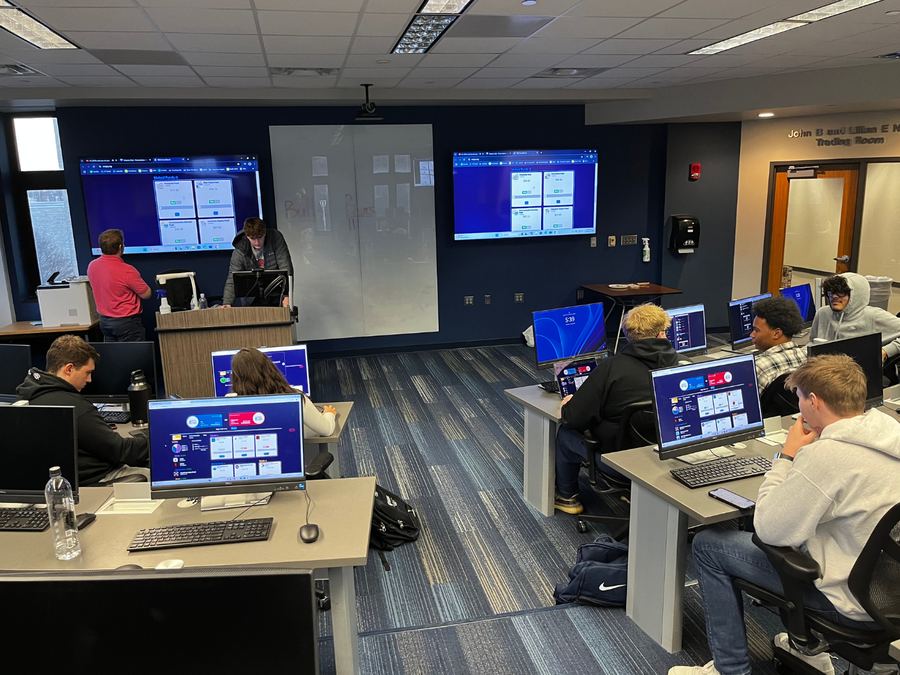 Members working at trading room screens during a Finance Club session