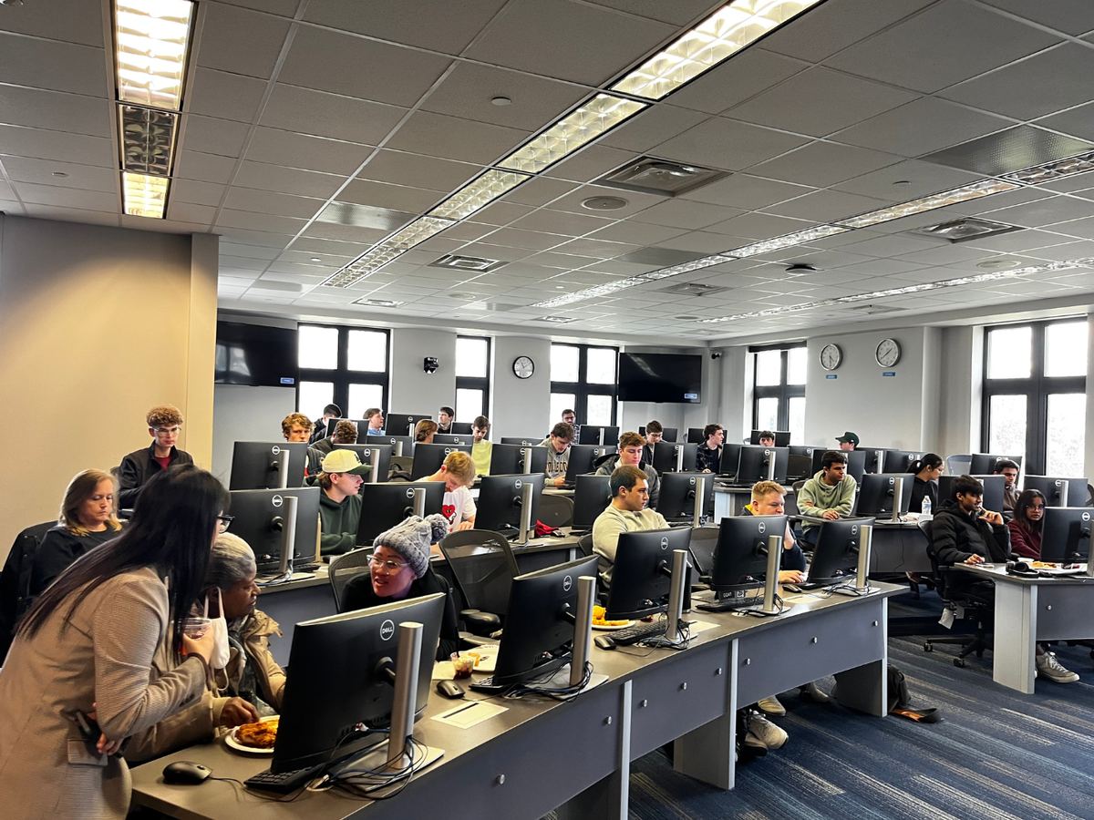 Students at a Finance Club meeting in the trading room